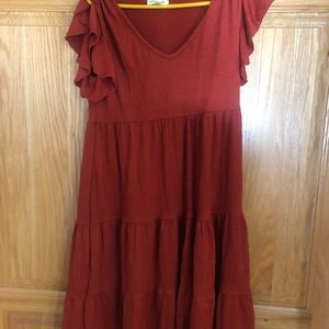 XS Max Studio tiered babydoll dress with fluttery sleeves.